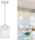 Chrome Kitchen Pendant Lights Over Island by Unknown