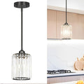 Black Kitchen Pendant Lights Over Island by Unknown